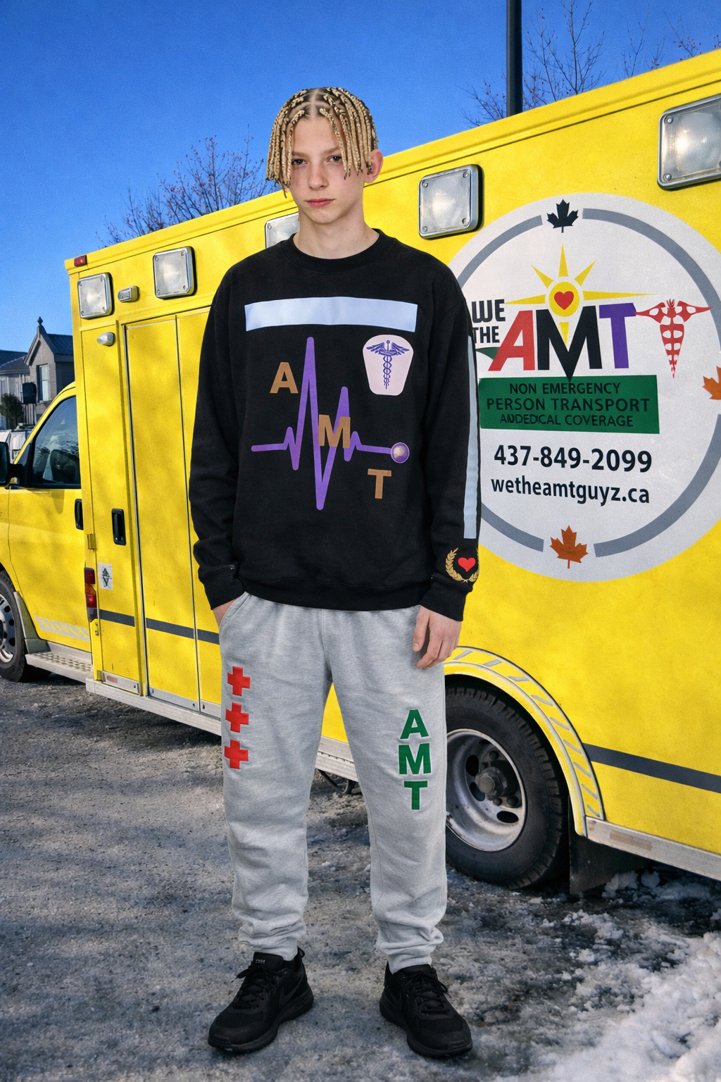 AMT GUYZ team member beside the yellow AMT vehicle